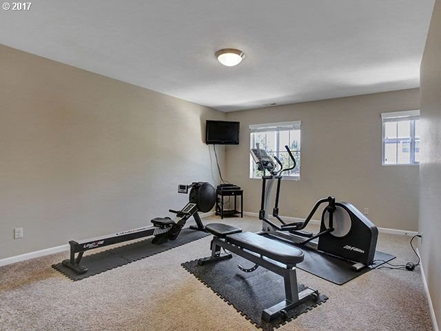 9478 Northwest Ember Lane Portland, OR 97229 - Photo 15 of 23 a room with gym equipment