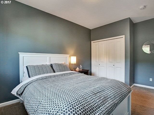 9478 Northwest Ember Lane Portland, OR 97229 - Photo 17 of 23 a bedroom with a bed and a night stand