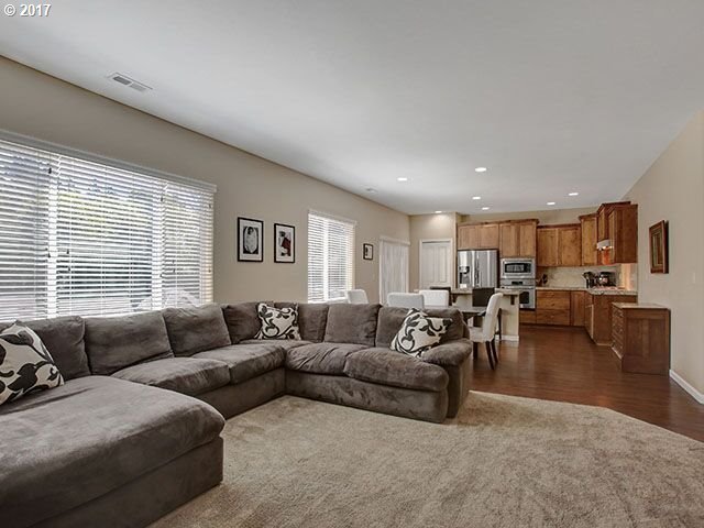 9478 Northwest Ember Lane Portland, OR 97229 - Photo 3 of 23 a living room with furniture and view of kitchen