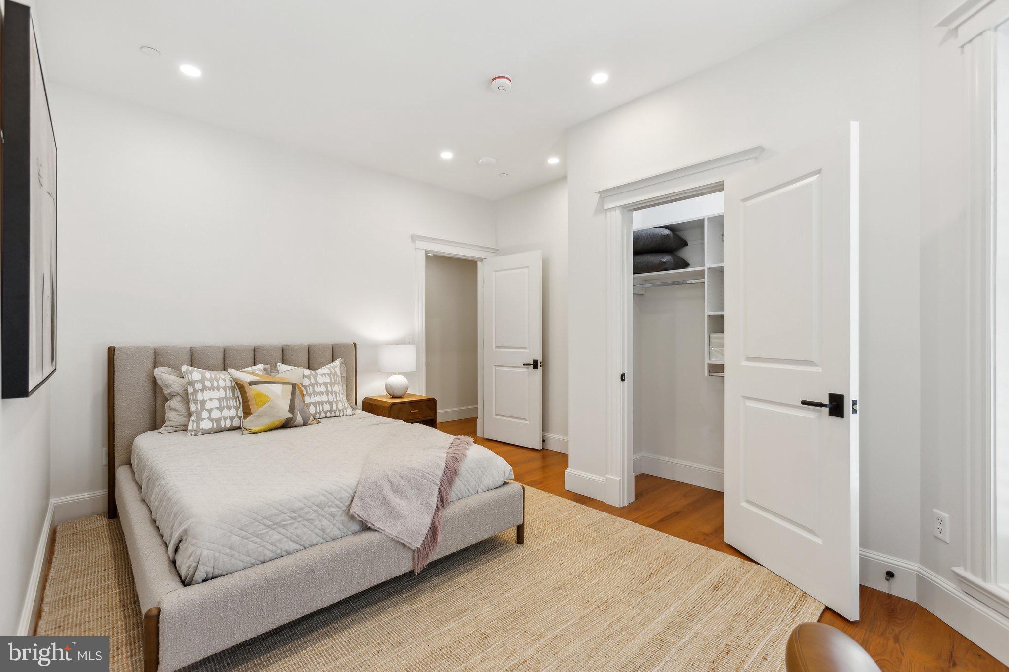 1641 R Street Northwest, Unit 301 Washington, DC 20009 - Photo 16 of 36 Serene bedroom with modern elegance.