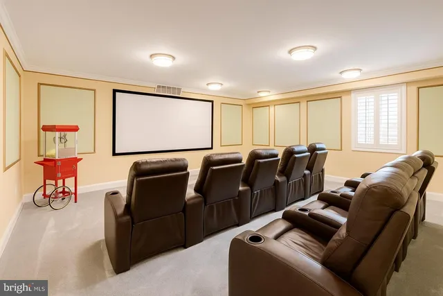 a media room with lots of chairs and a projector