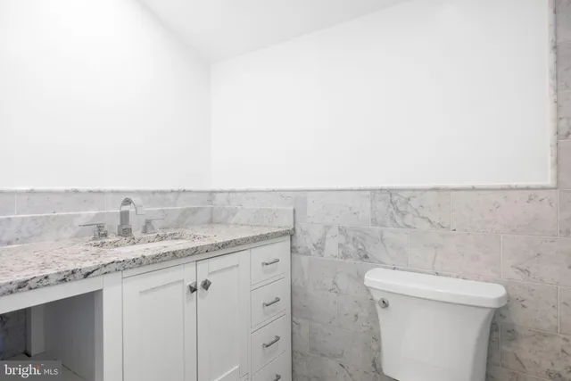 a bathroom with a shower and a toilet