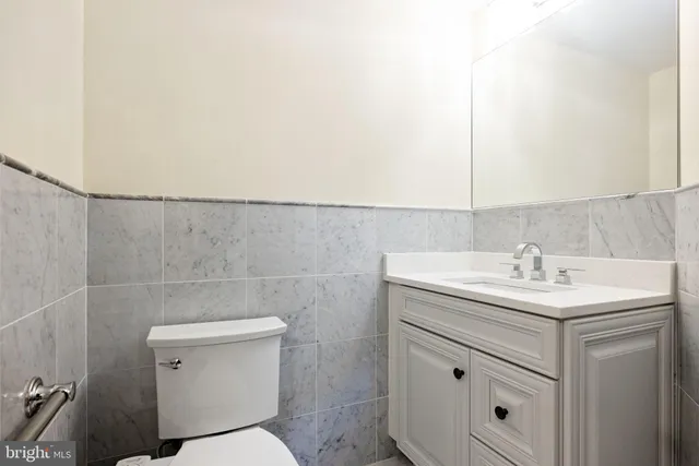 a kitchen with granite countertop a sink and cabinets