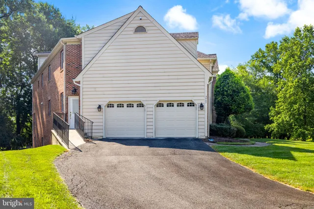 a building outdoor space with patio furniture and potted plants