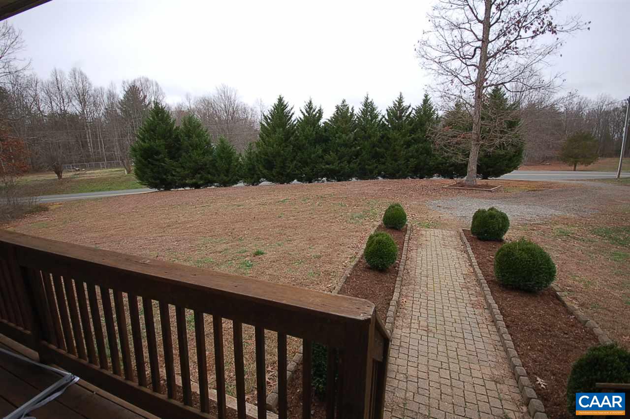 5075 Celt Road Stanardsville, VA 22973 - Photo 11 of 36 a view of a roof deck with couches and wooden fence
