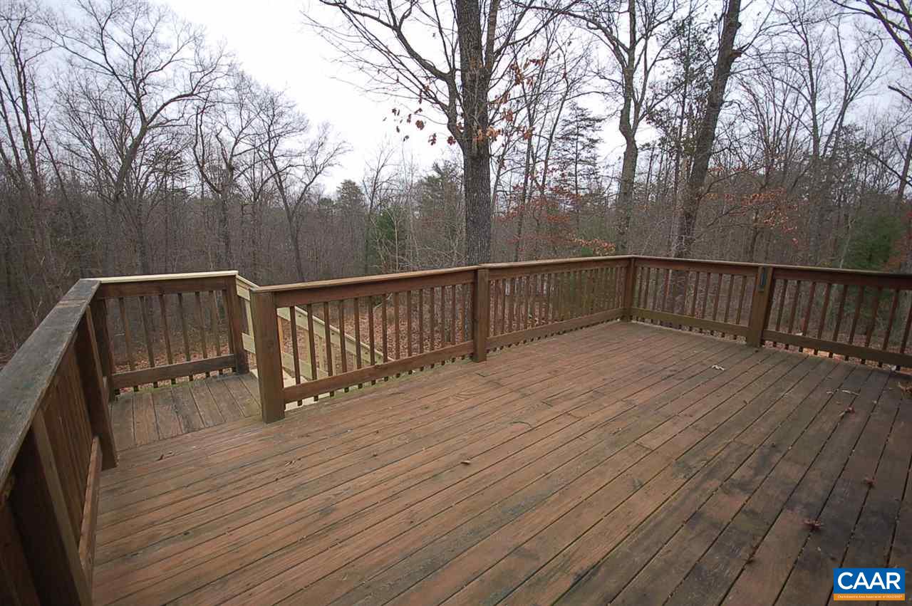 5075 Celt Road Stanardsville, VA 22973 - Photo 13 of 36 a terrace with trees in the background