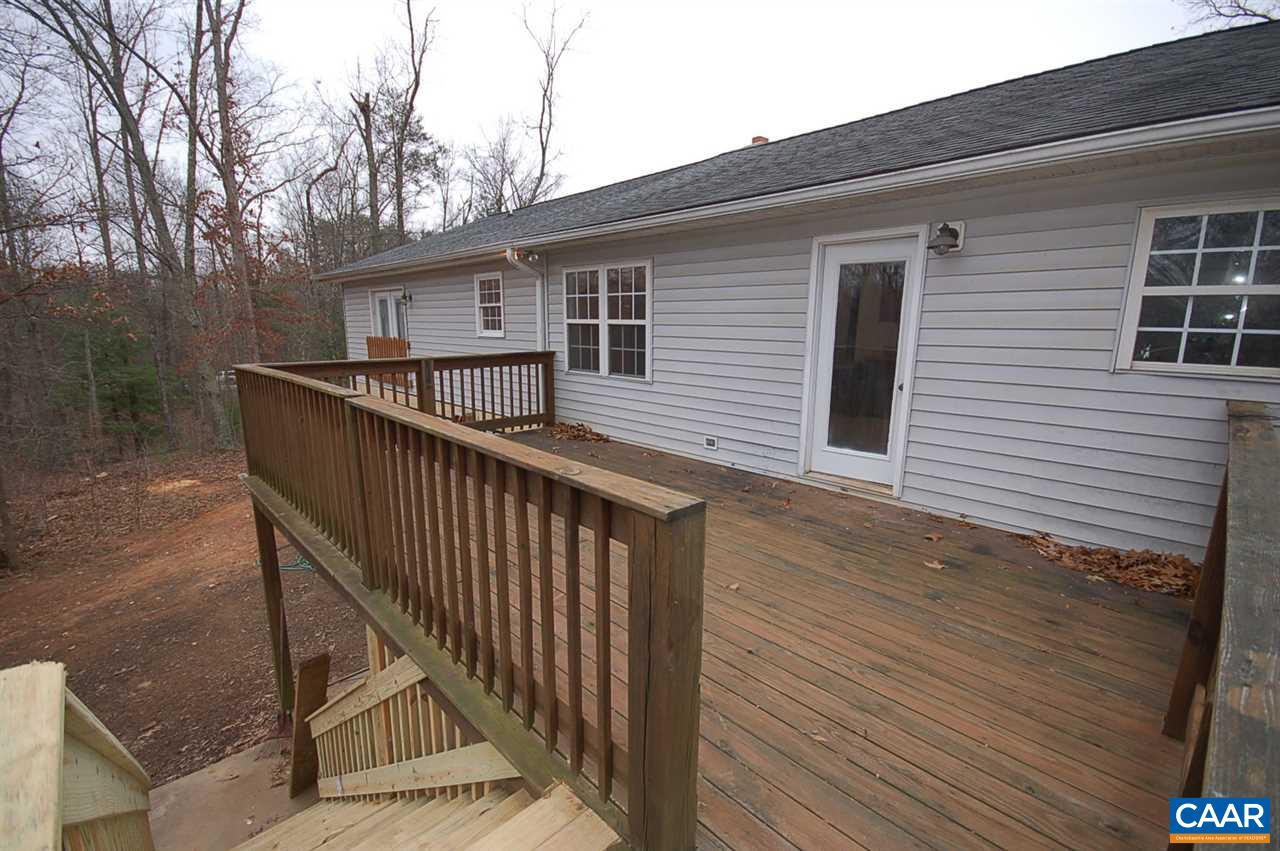 5075 Celt Road Stanardsville, VA 22973 - Photo 15 of 36 a view of a house with wooden deck