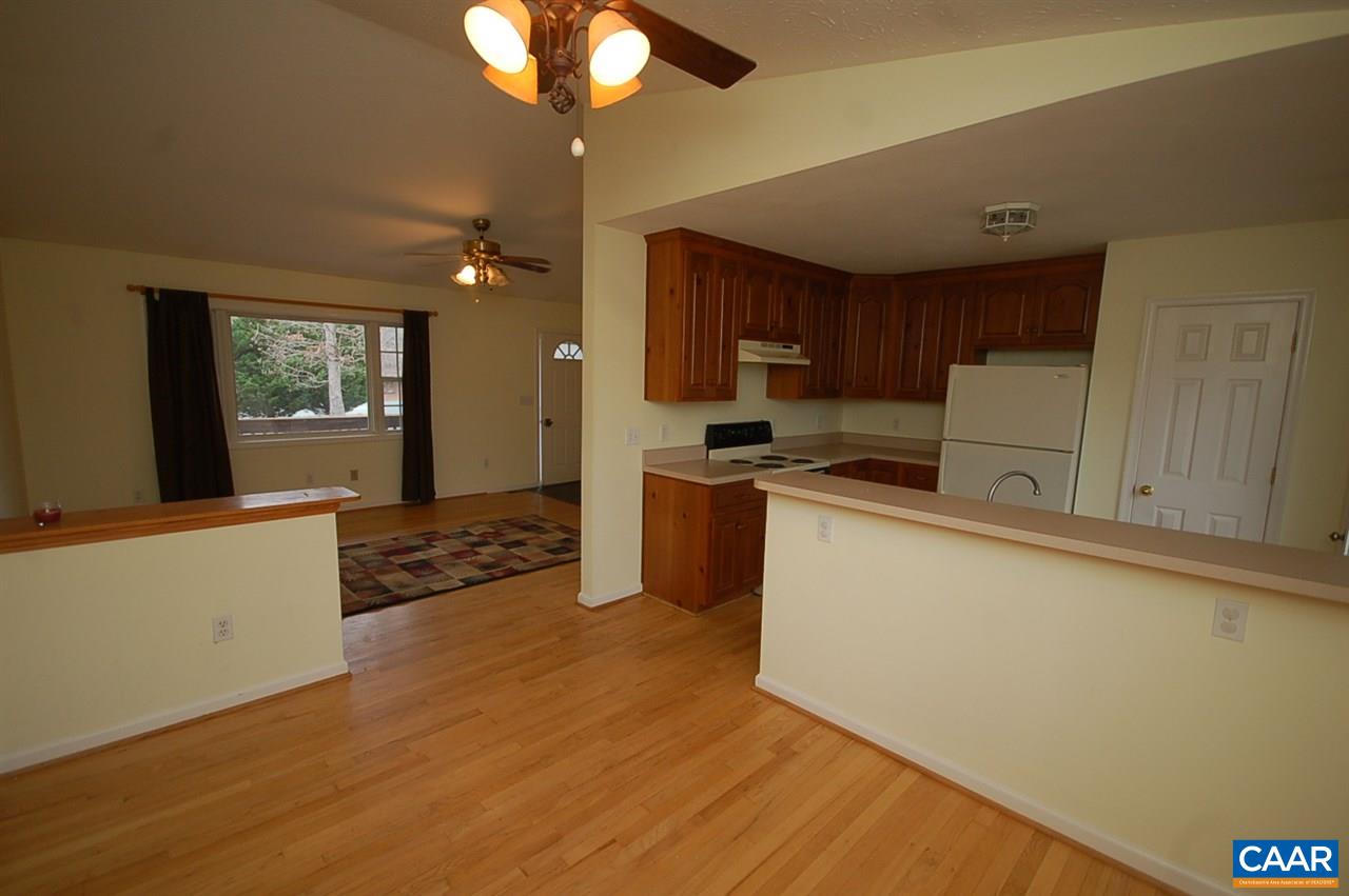 5075 Celt Road Stanardsville, VA 22973 - Photo 18 of 36 a kitchen with stainless steel appliances granite countertop a refrigerator a stove top oven a sink and dishwasher