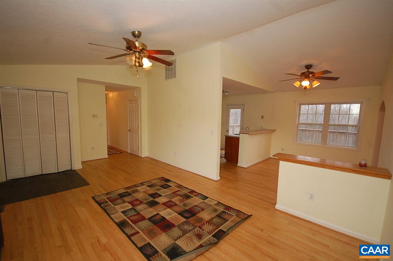 5075 Celt Road Stanardsville, VA 22973 - Photo 19 of 36 a bedroom with a bed and a chandelier