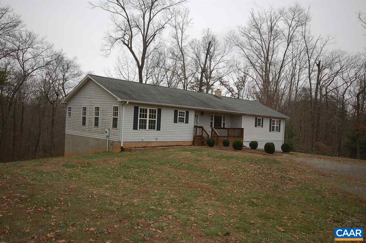 5075 Celt Road Stanardsville, VA 22973 - Photo 2 of 36 a front view of a house with a garden and trees