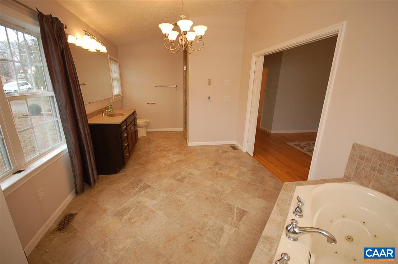 5075 Celt Road Stanardsville, VA 22973 - Photo 34 of 36 a bedroom with a bed dresser and a window