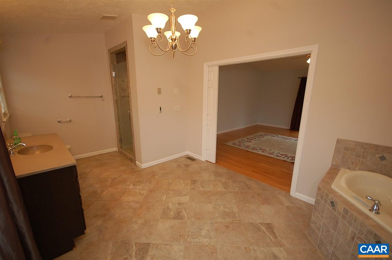 5075 Celt Road Stanardsville, VA 22973 - Photo 35 of 36 a view of livingroom with hardwood floor and kitchen