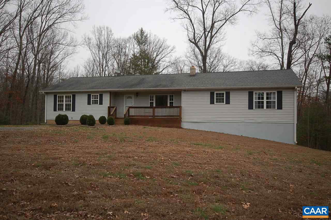 5075 Celt Road Stanardsville, VA 22973 - Photo 4 of 36 a front view of house with yard and trees in the background