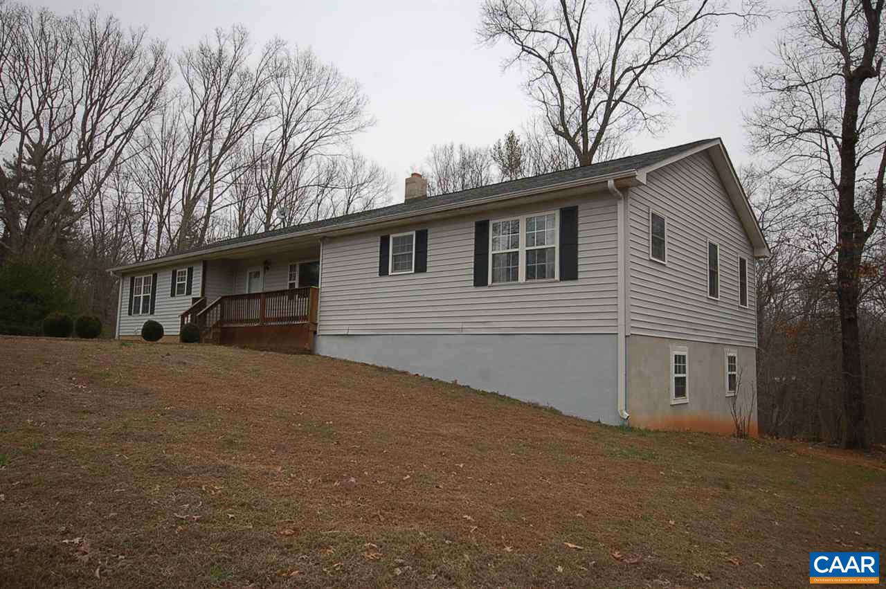 5075 Celt Road Stanardsville, VA 22973 - Photo 5 of 36 a view of a house with a yard and garage