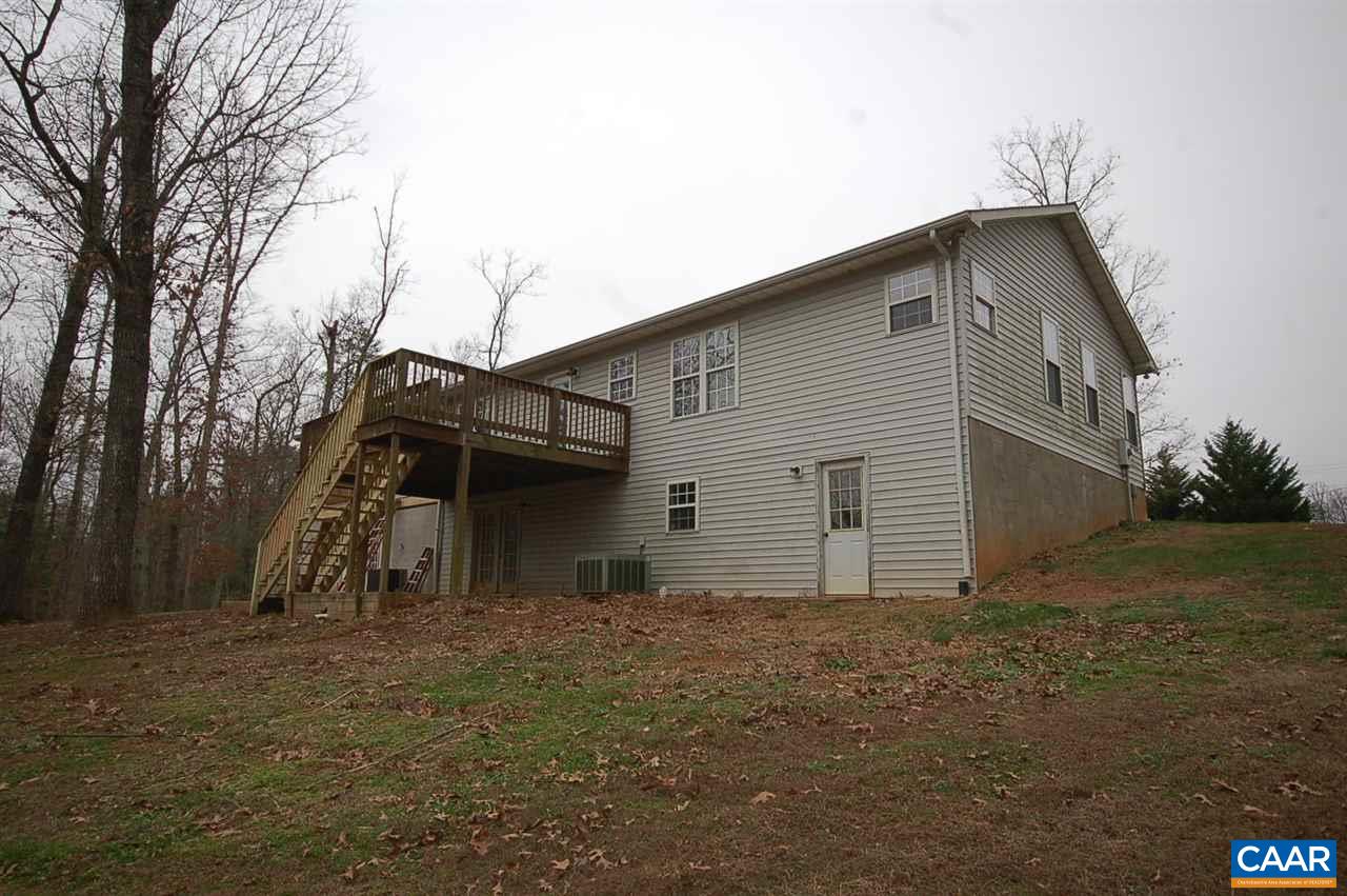 5075 Celt Road Stanardsville, VA 22973 - Photo 8 of 36 a house with trees in front of it
