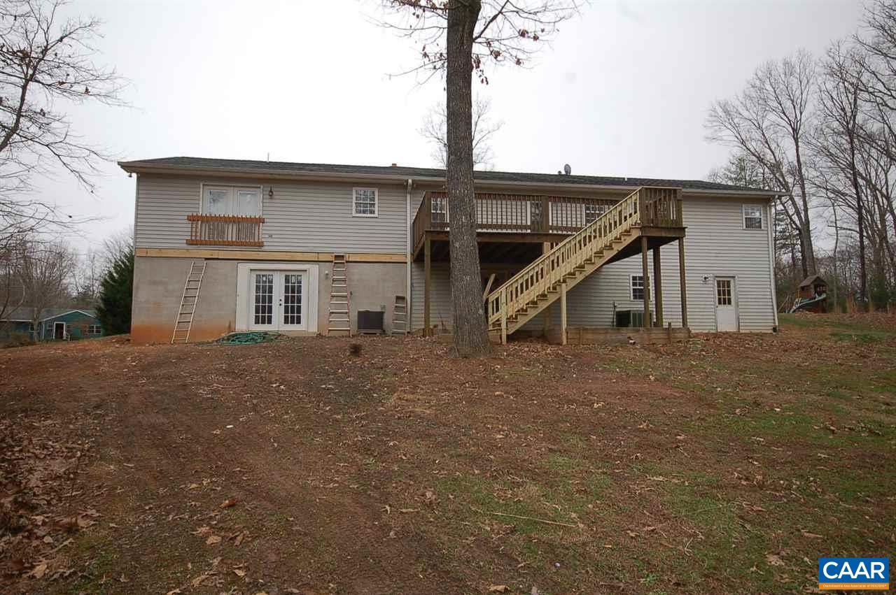 5075 Celt Road Stanardsville, VA 22973 - Photo 9 of 36 a front view of a house with a yard