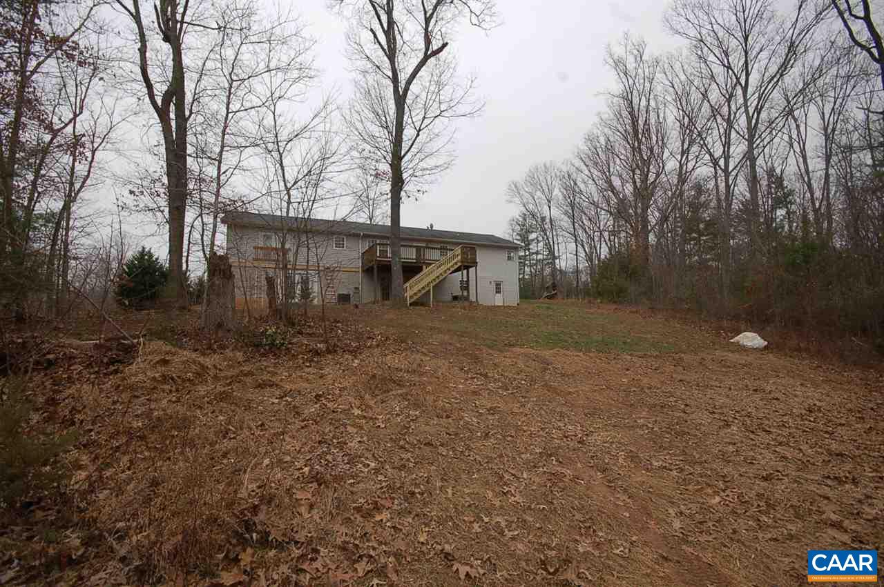 5075 Celt Road Stanardsville, VA 22973 - Photo 10 of 36 a view of a backyard with large trees
