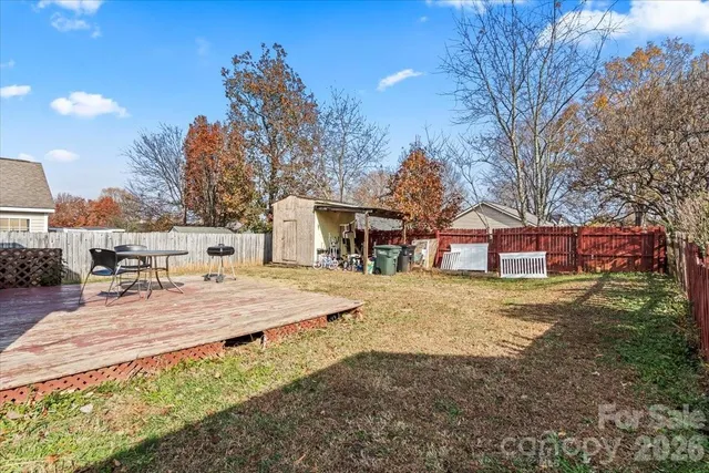 a view of a house with a yard and roof
