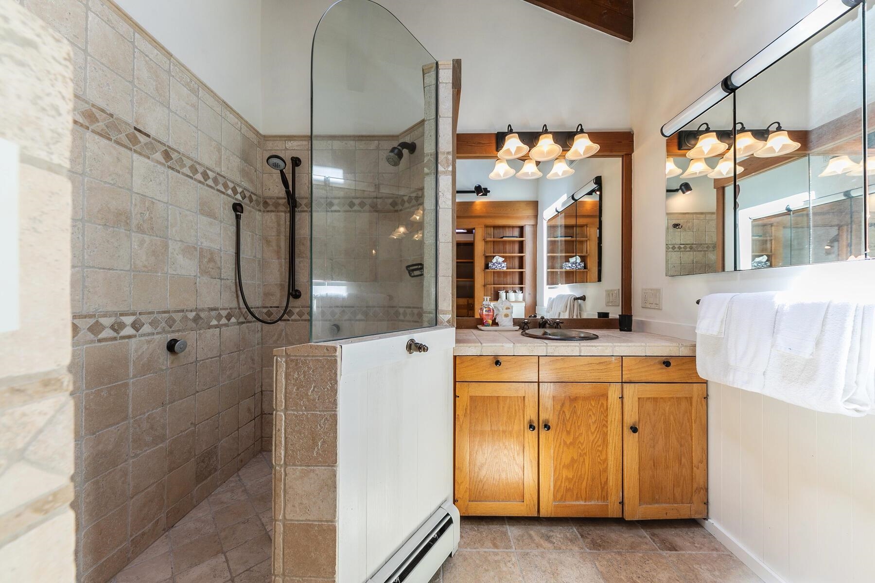488 Old County Road Carnelian Bay, CA 96140 - Photo 17 of 21 a bathroom with a granite countertop shower sink and mirror