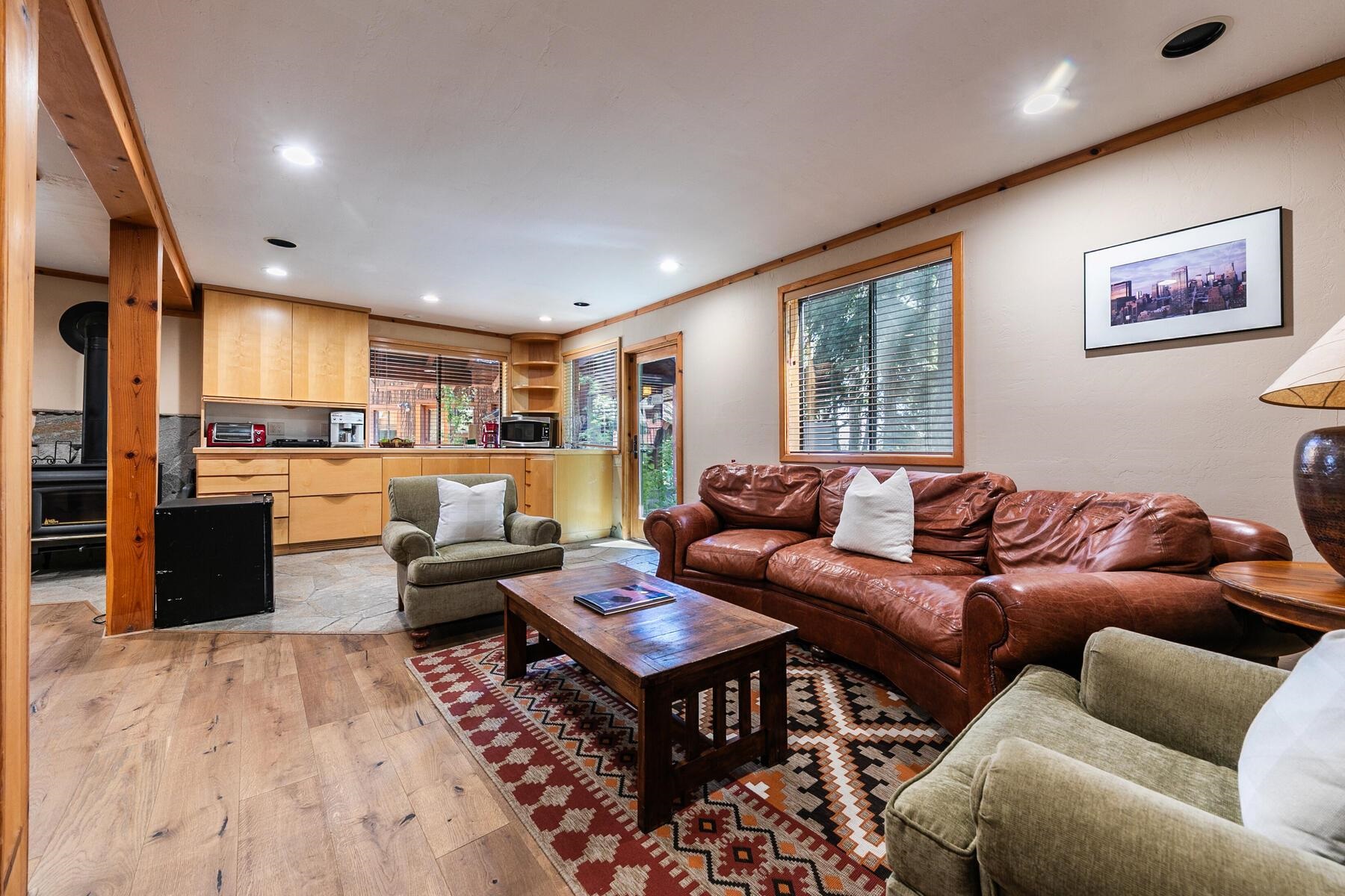 488 Old County Road Carnelian Bay, CA 96140 - Photo 19 of 21 a living room with furniture kitchen view and a large window