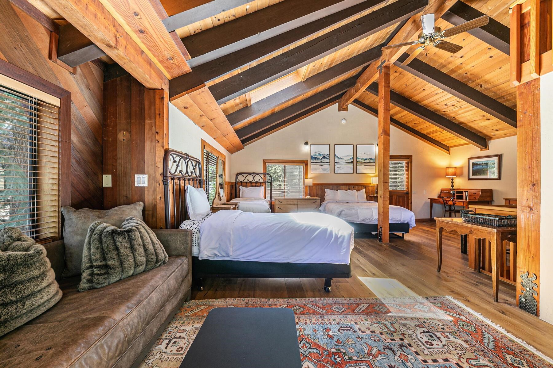 488 Old County Road Carnelian Bay, CA 96140 - Photo 20 of 21 a bedroom with furniture and a chandelier