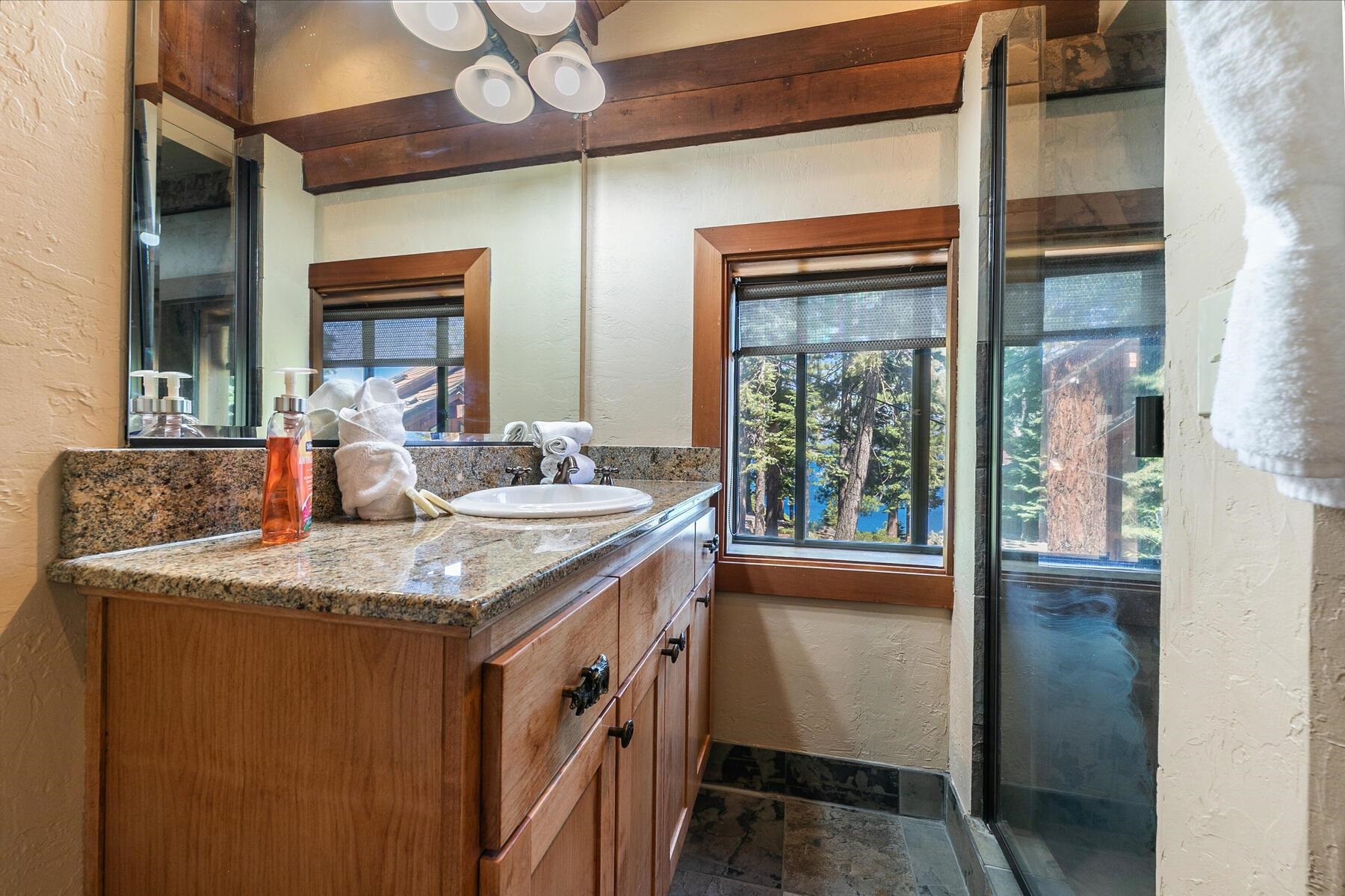 488 Old County Road Carnelian Bay, CA 96140 - Photo 21 of 21 a kitchen with a sink and a refrigerator
