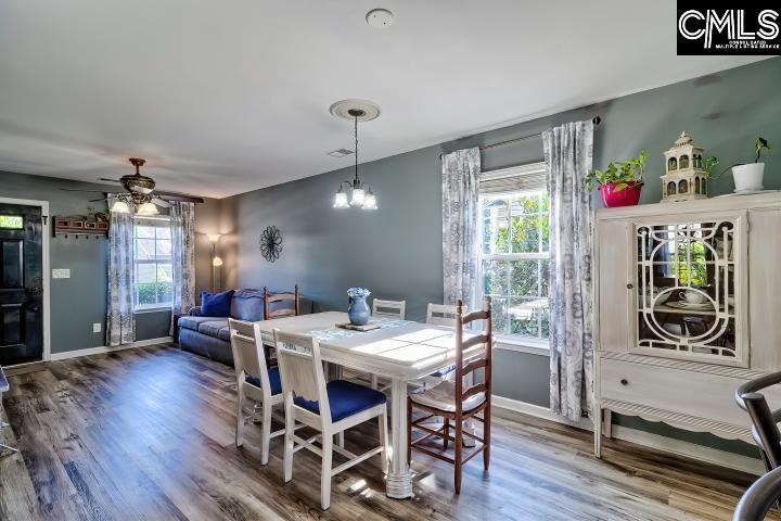 209 Eagle Pointe Drive Chapin, SC 29036 - Photo 11 of 40 a view of a dining room with furniture window and wooden floor