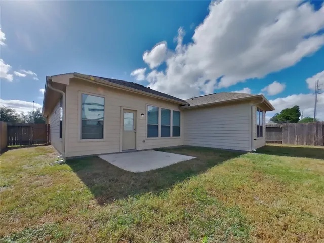 a view of a backyard of the house