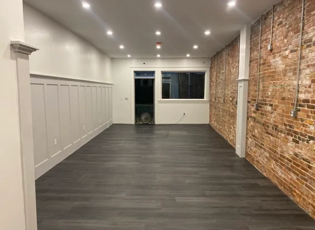 a view of entryway with wooden floor