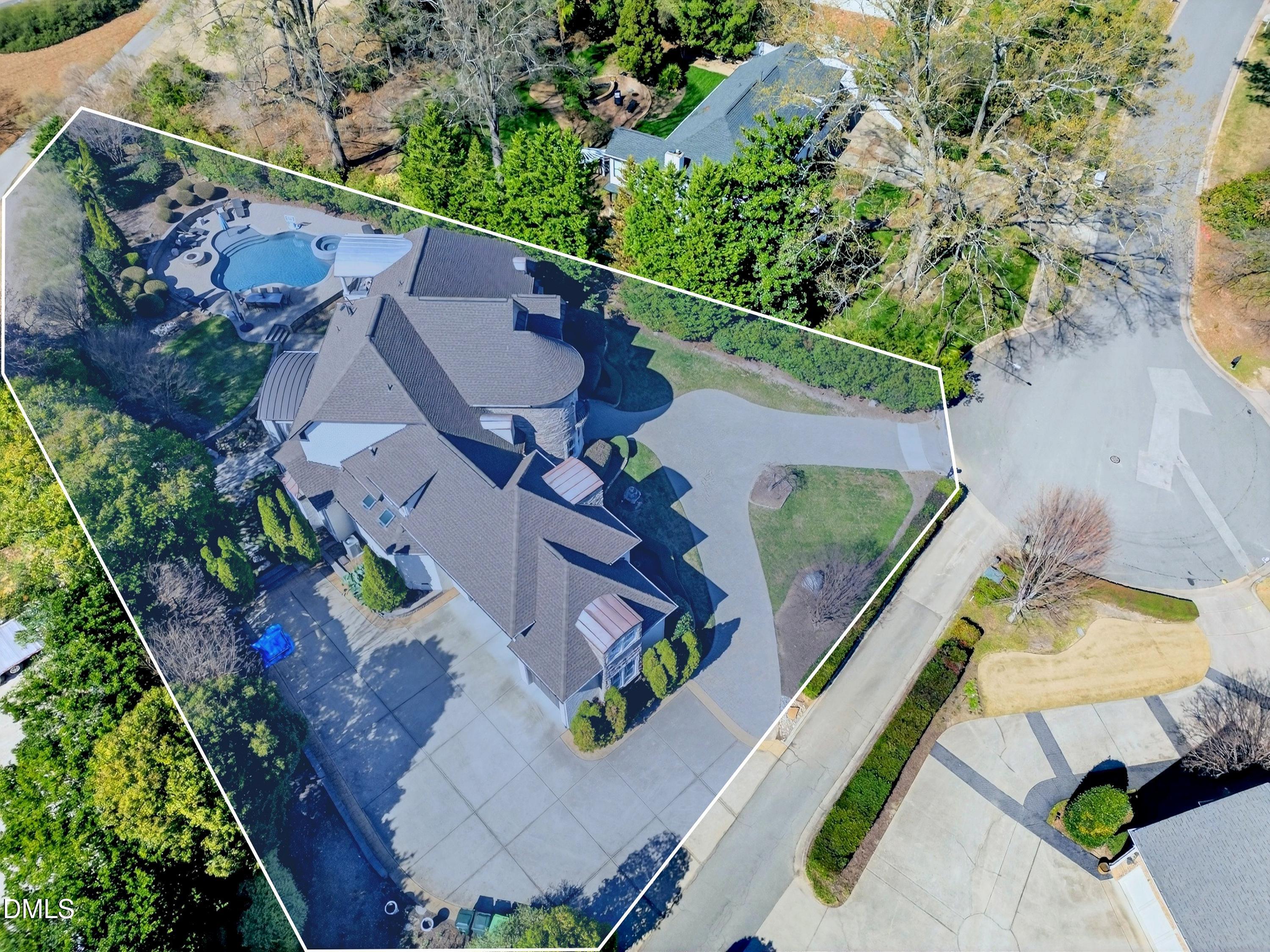 6701 Foxfire Place Raleigh, NC 27615 - Photo 57 of 67 an aerial view of a house with a garden and lake view