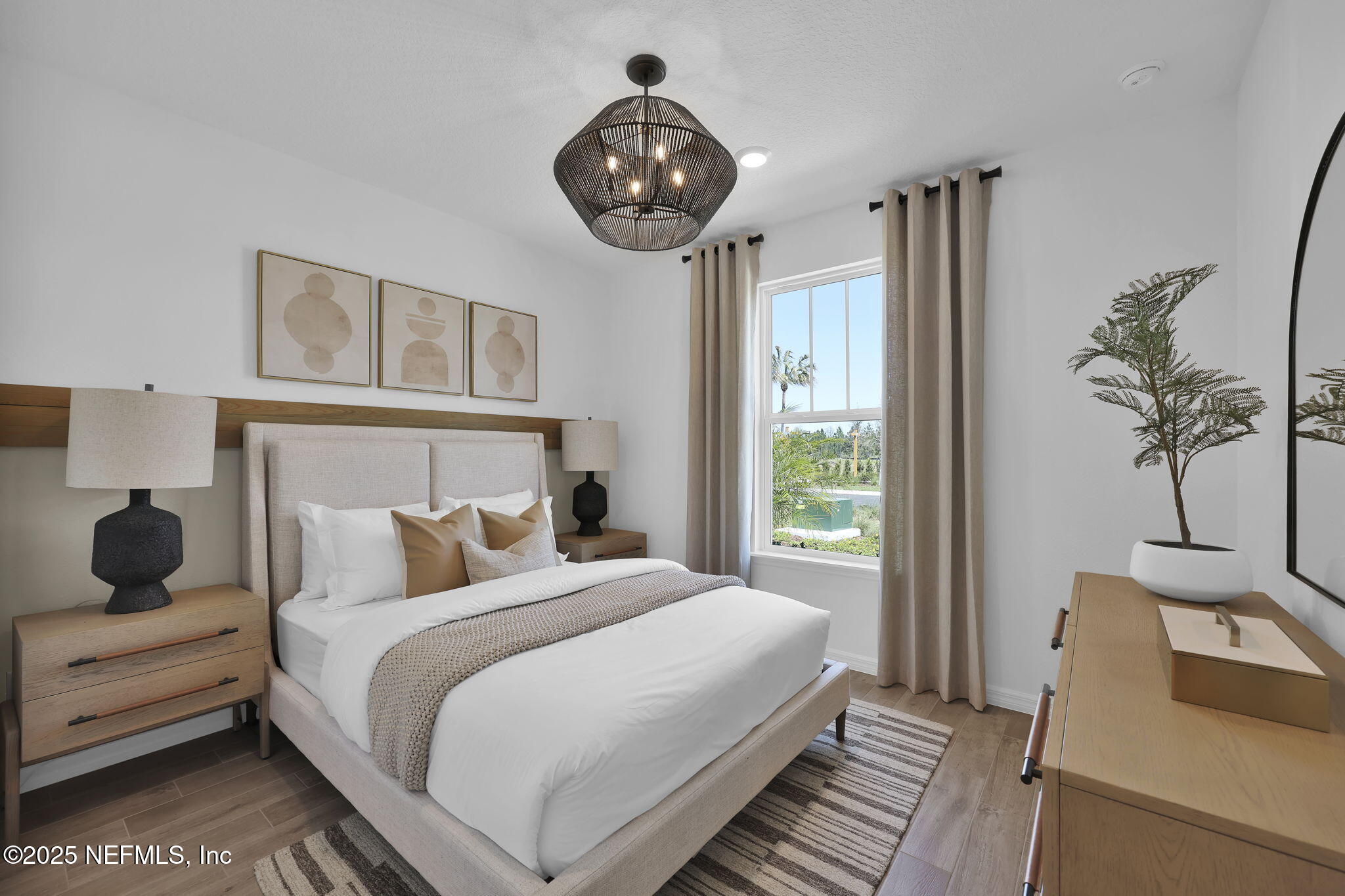 124 Headstream Drive St. Johns, FL 32259 - Photo 13 of 22 a bedroom with a bed a window and potted plant