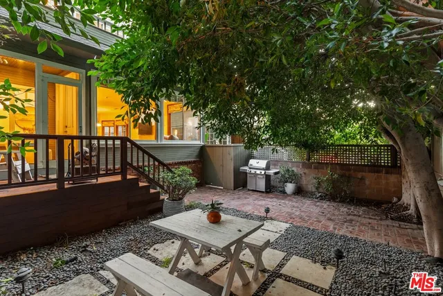 a view of a chairs and table in the patio