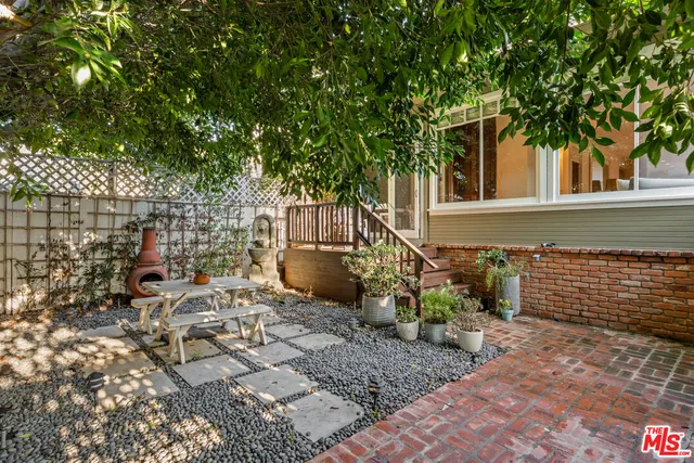 a view of a backyard with sitting area