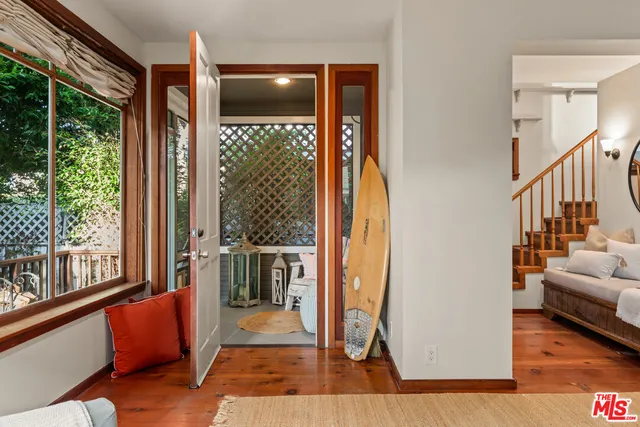 a view of living room with furniture and windows