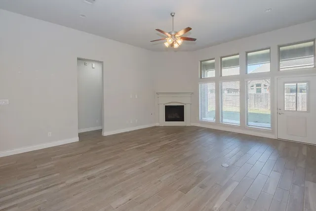 a view of an entryway with wooden floor