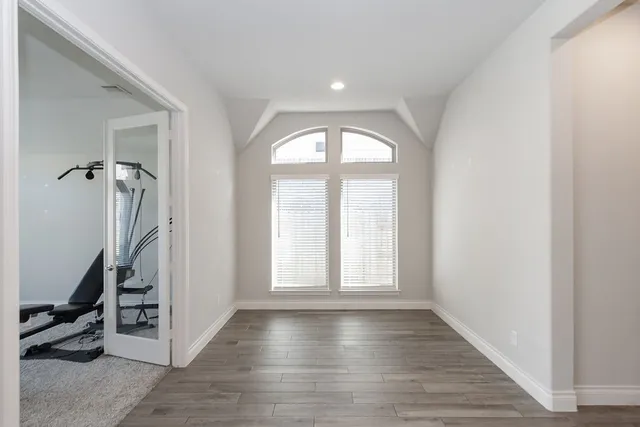 a kitchen with stainless steel appliances granite countertop a sink a stove and a refrigerator