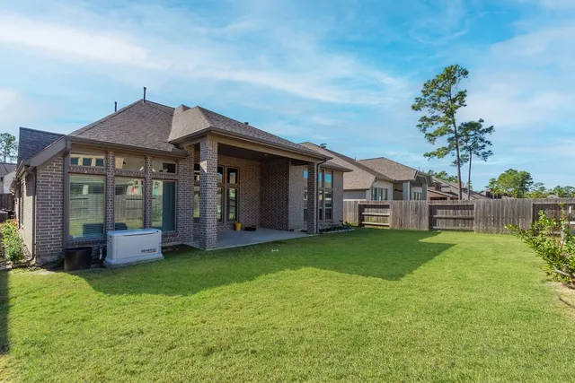 a view of a house with a yard and plants