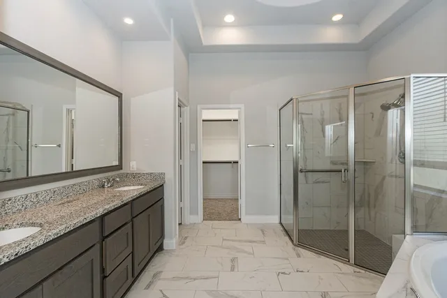 a bathroom with a granite countertop sink mirror and double