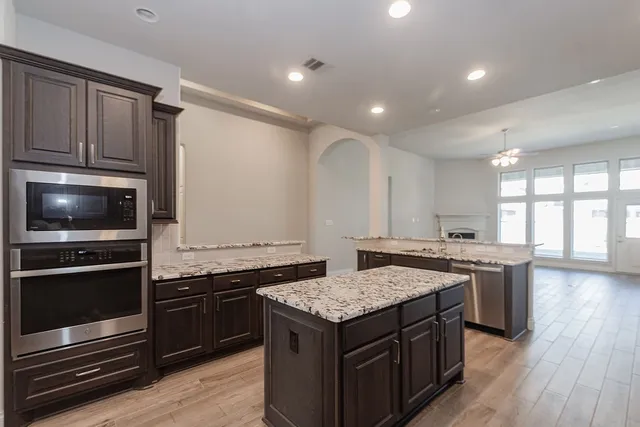 a kitchen with a stove and a microwave