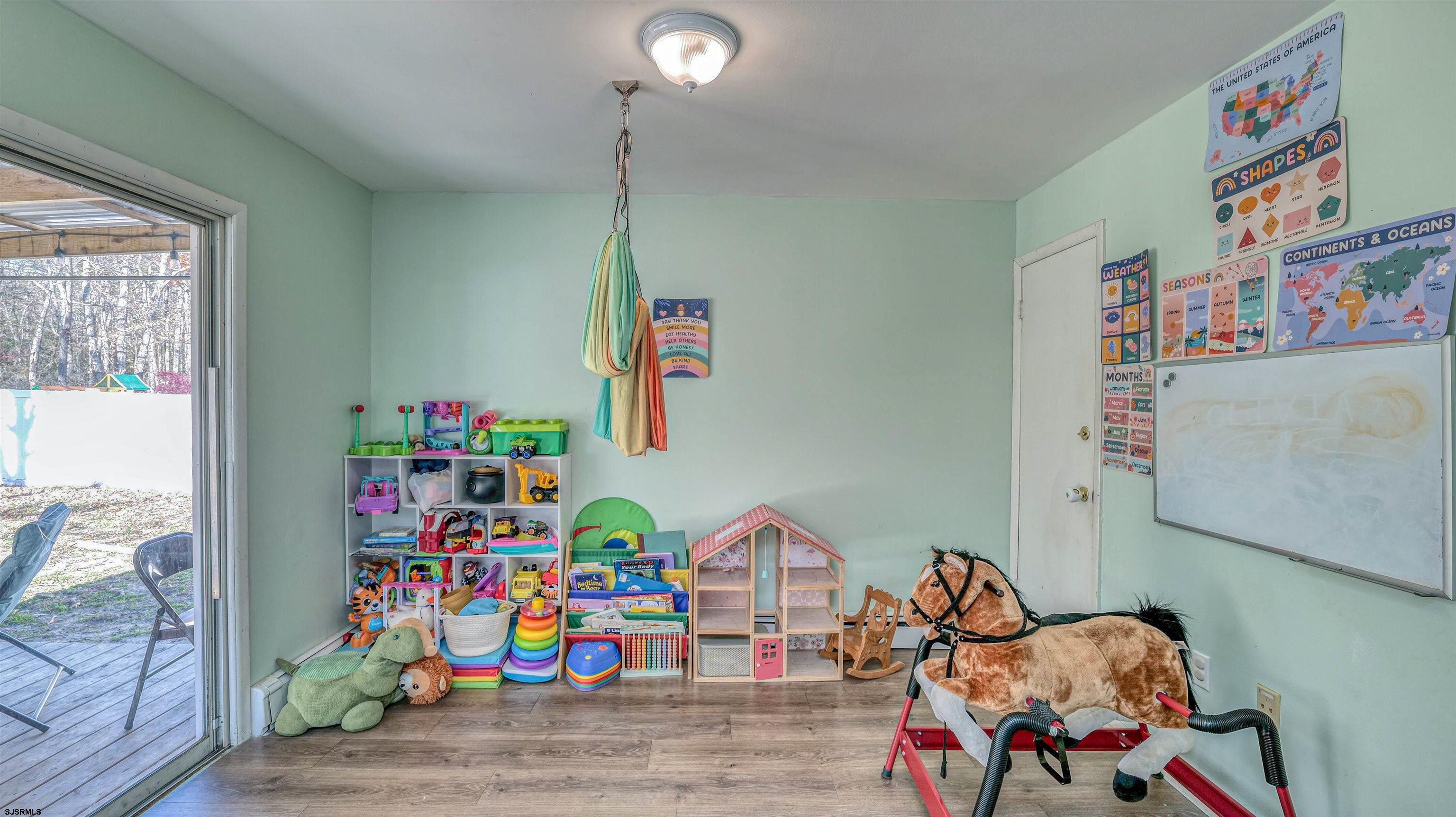 61 Leitz Boulevard Tuckerton, NJ 08087 - Photo 12 of 24 a play room with toys