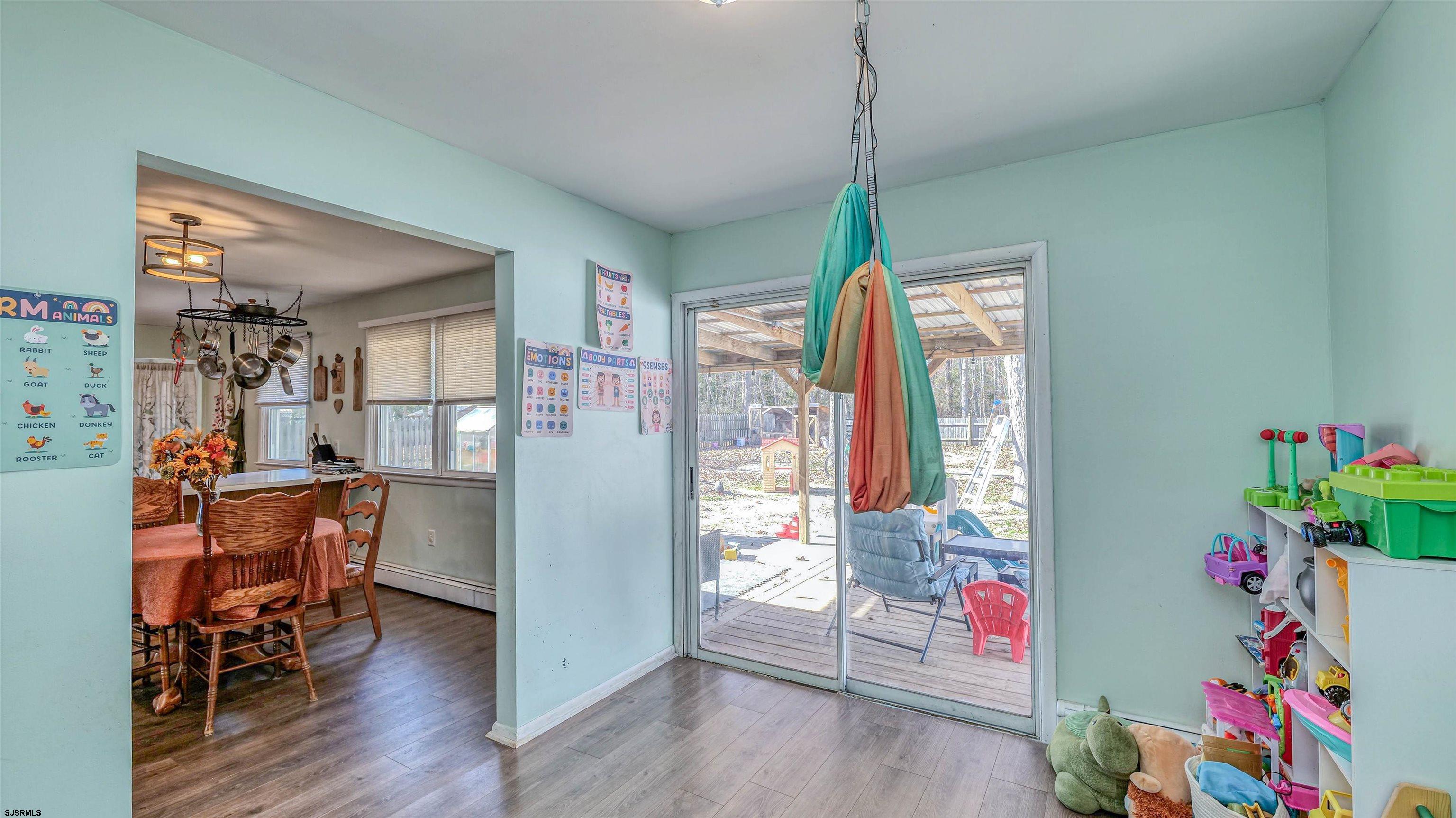 61 Leitz Boulevard Tuckerton, NJ 08087 - Photo 13 of 24 a living room with furniture and a window