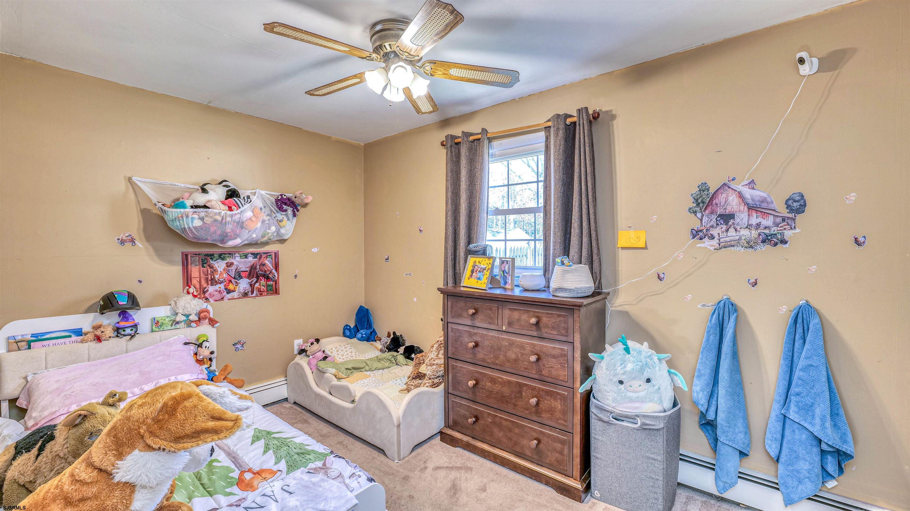 61 Leitz Boulevard Tuckerton, NJ 08087 - Photo 19 of 24 a bedroom with a bed and wooden floor