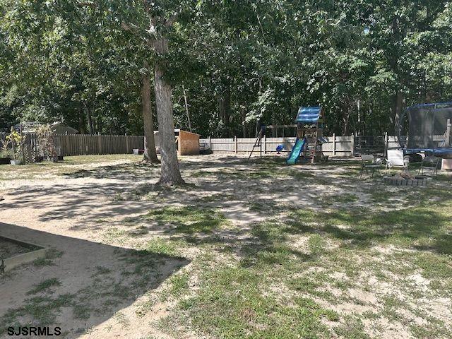 61 Leitz Boulevard Tuckerton, NJ 08087 - Photo 22 of 24 a view of a outdoor space with lots of trees