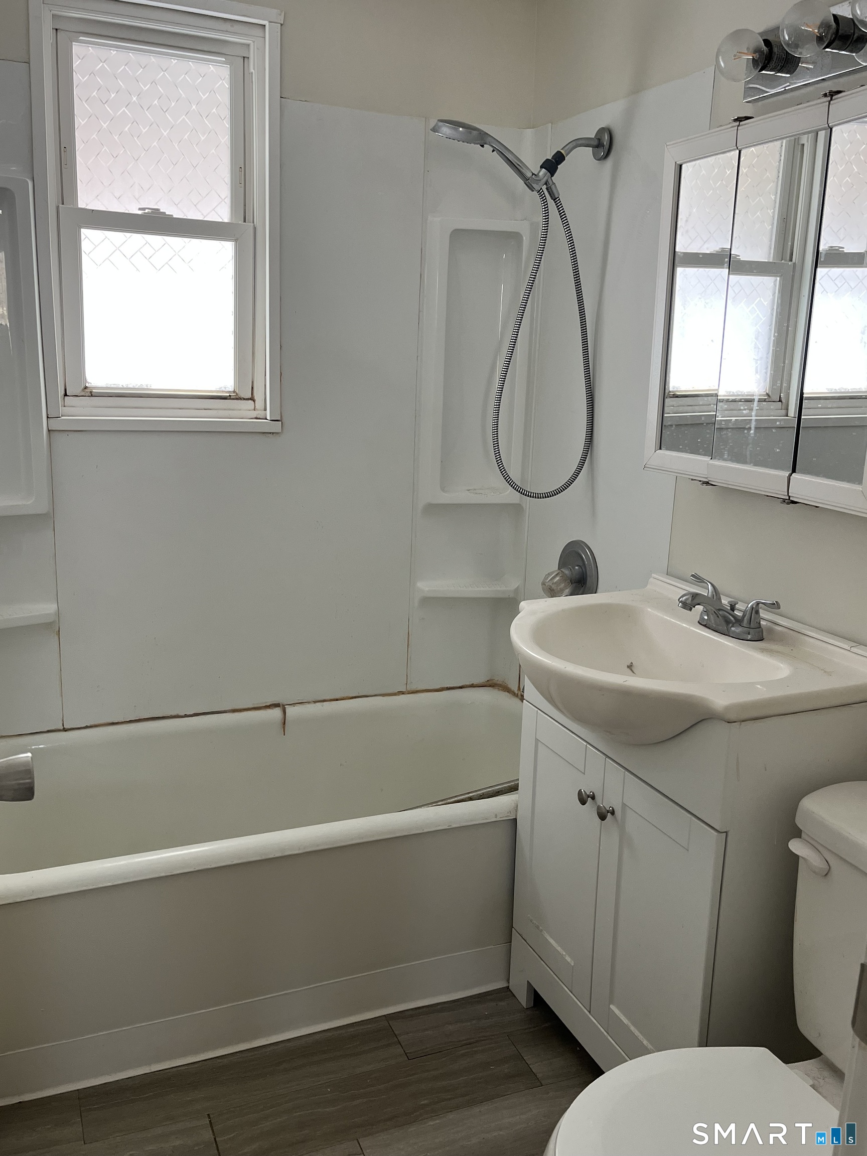 20 John Street Southington, CT 06489 - Photo 13 of 17 a bathroom with a sink a toilet and shower