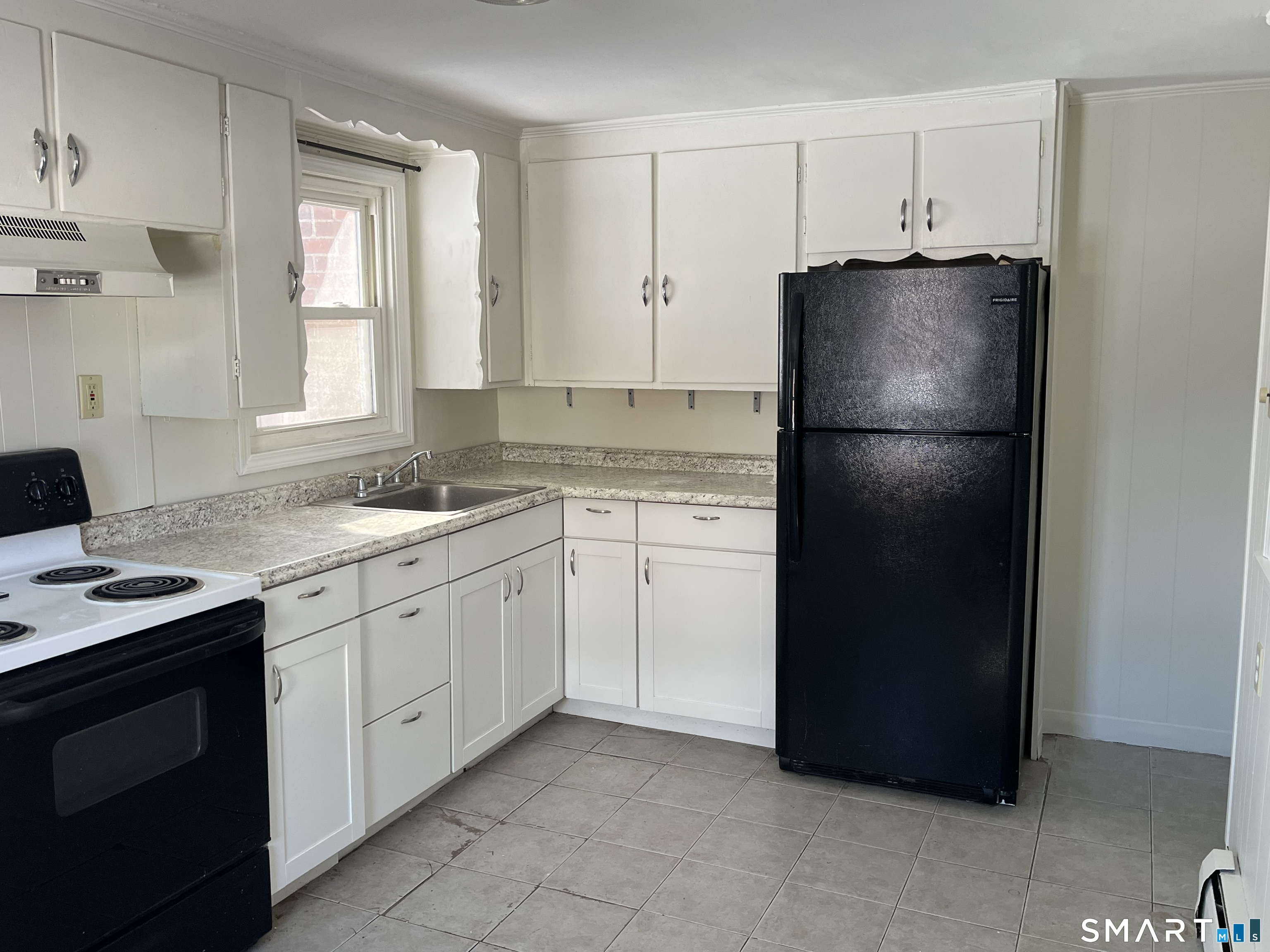 20 John Street Southington, CT 06489 - Photo 9 of 17 a kitchen with a refrigerator stove and sink
