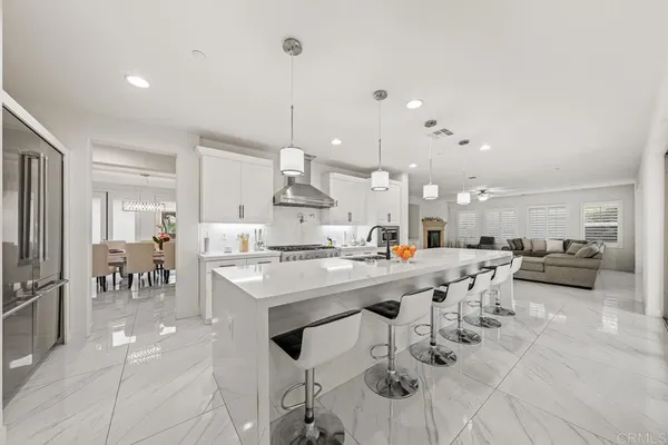 a kitchen with stainless steel appliances granite countertop a stove and a refrigerator