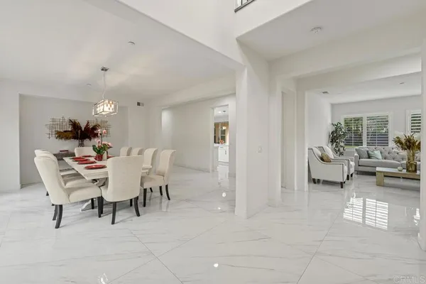 a living room with furniture and large window