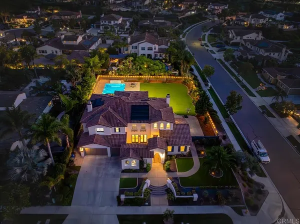 an aerial view of swimming pool with outdoor seating