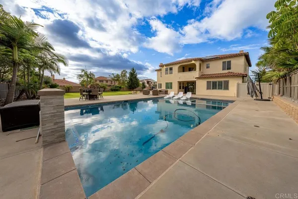 a front view of a house with swimming pool