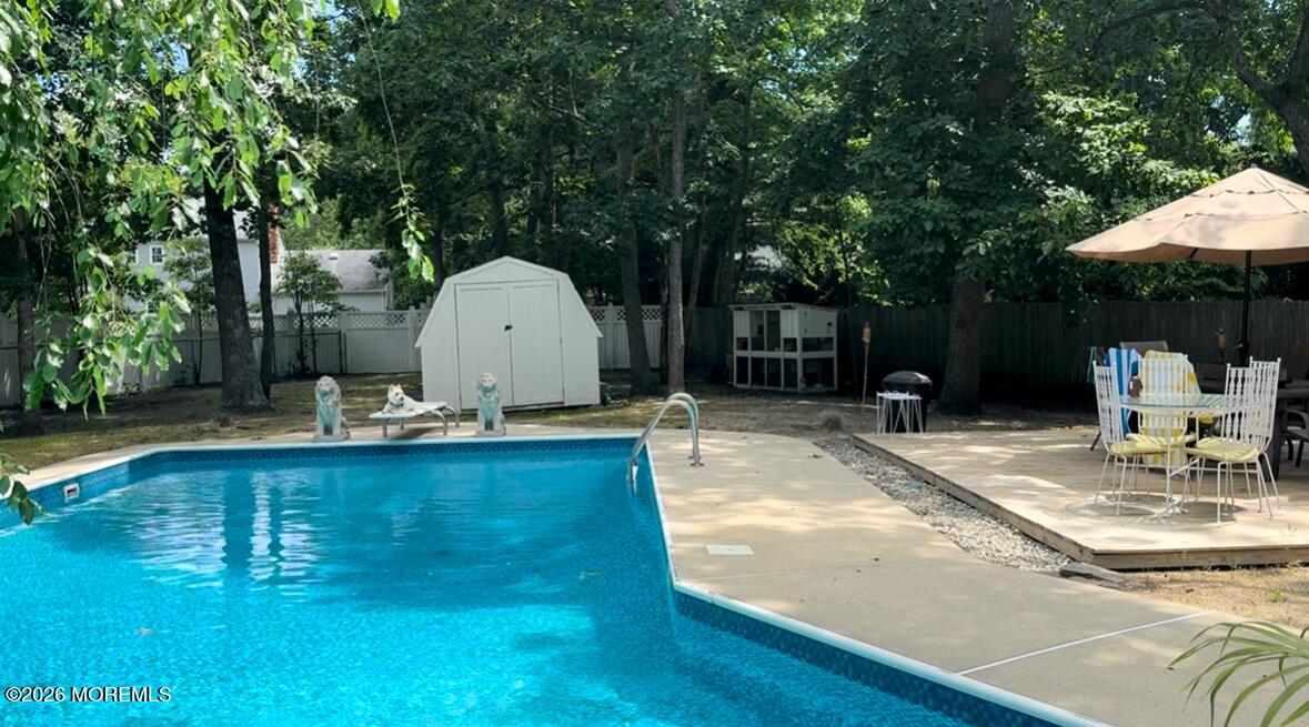 18 Liverpool Court Jackson, NJ 08527 - Photo 13 of 16 a view of a swimming pool with a patio
